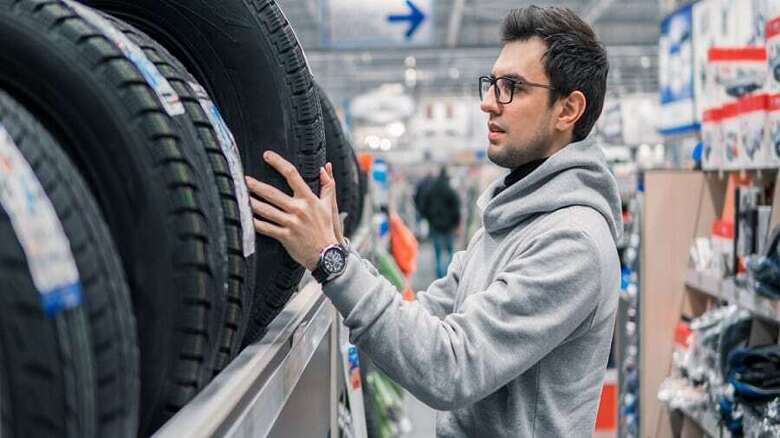 Man buying tires