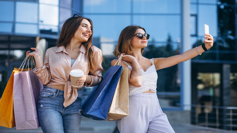 Two women holding shopping bags