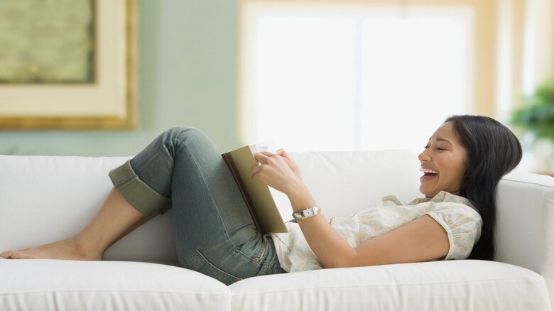 Woman reading and laughing